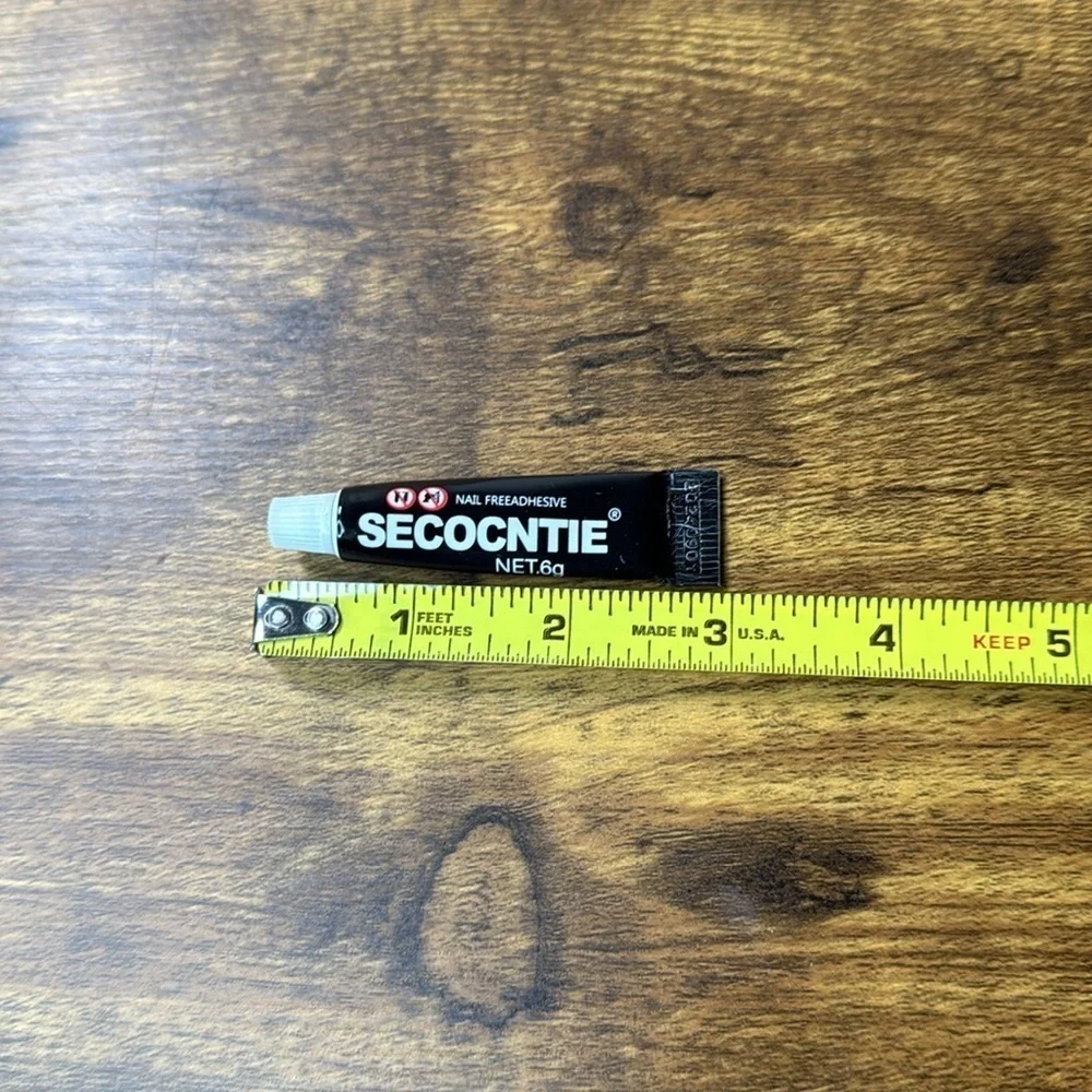 Black Nail Adhesive Tube